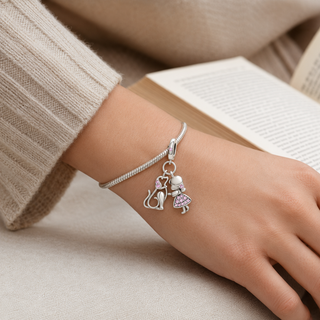 Always By Your Side Dog Charm worn at realistic scale on a silver charm bracelet