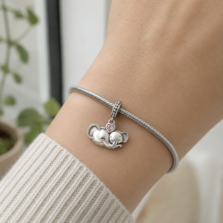 The Always Near Elephant Charm worn at true scale on a silver charm bracelet