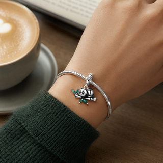 The Daydream Panda Charm worn at true scale on a silver charm bracelet