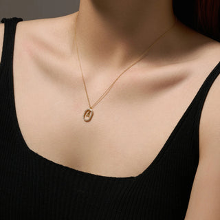 Initial letter necklace with removable pendant worn on model