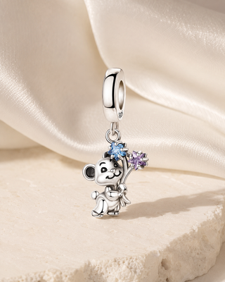 The Little Bloom Bunny Charm story image on ivory silk and pale stone