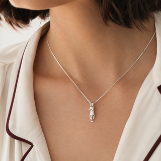 The Little Climber Cat Necklace worn at the collarbone