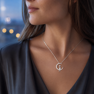 The Moonlit Cat Necklace worn at the neckline