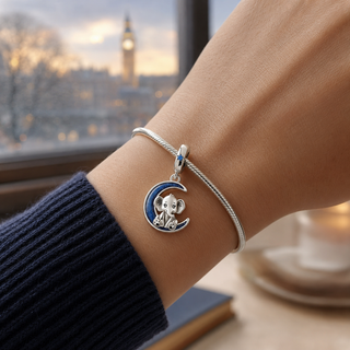 The Moonlit Elephant Charm worn at true scale on a silver charm bracelet