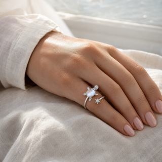 The Moonlit Turtle Ring worn on the hand