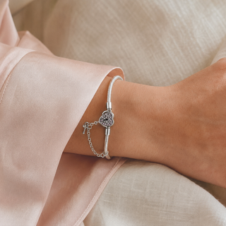 The Secret Heart Charm Bracelet worn on wrist