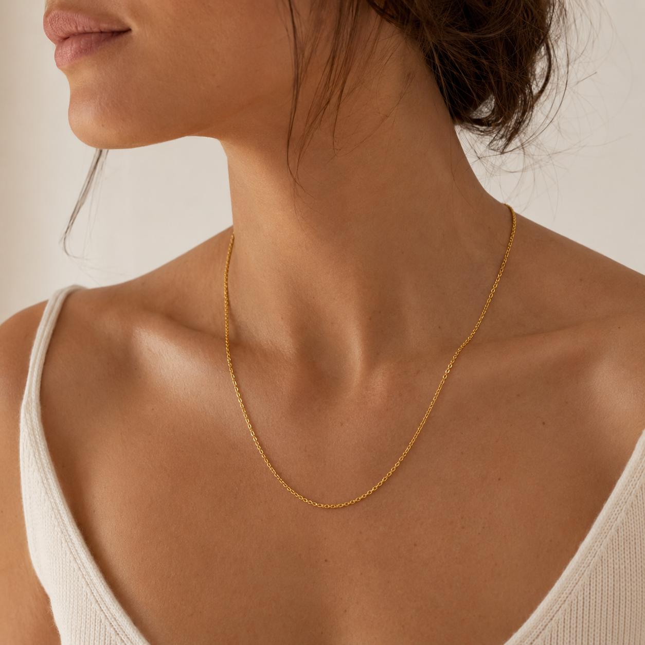 The Story Chain Necklace in 18ct gold plated finish worn by a model