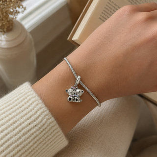 Tender Bear charm worn on a silver bracelet at realistic scale