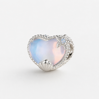 The Opal Shell Heart Charm on a neutral F5F5F5 background