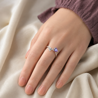 The Trinity Heart Ring worn on the hand